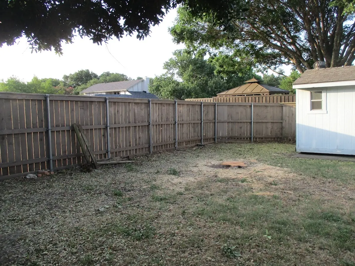 Cleared yard after professional tree removal in Keshena